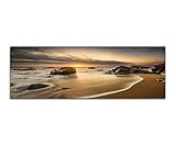Paul Sinus Art Panoramabild auf Leinwand und Keilrahmen 150x50cm Meer Strand Steine Sonnenaufgang Wolken